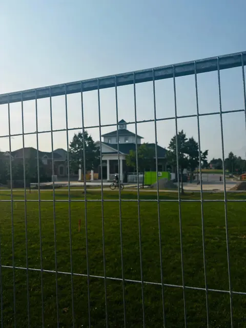 The fence goes up around the Pavilion.
