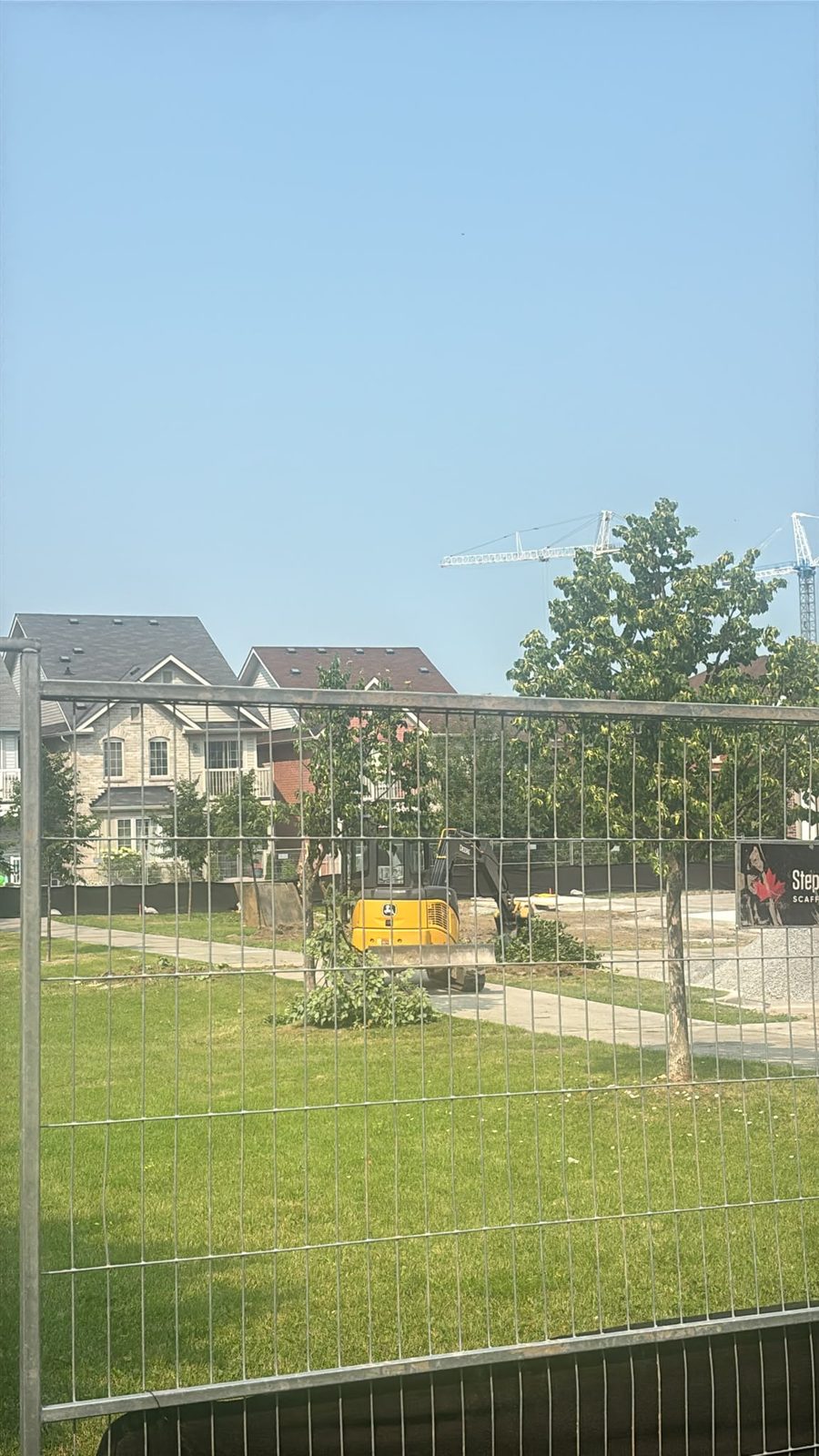 An excavator on site. A tree is already down.