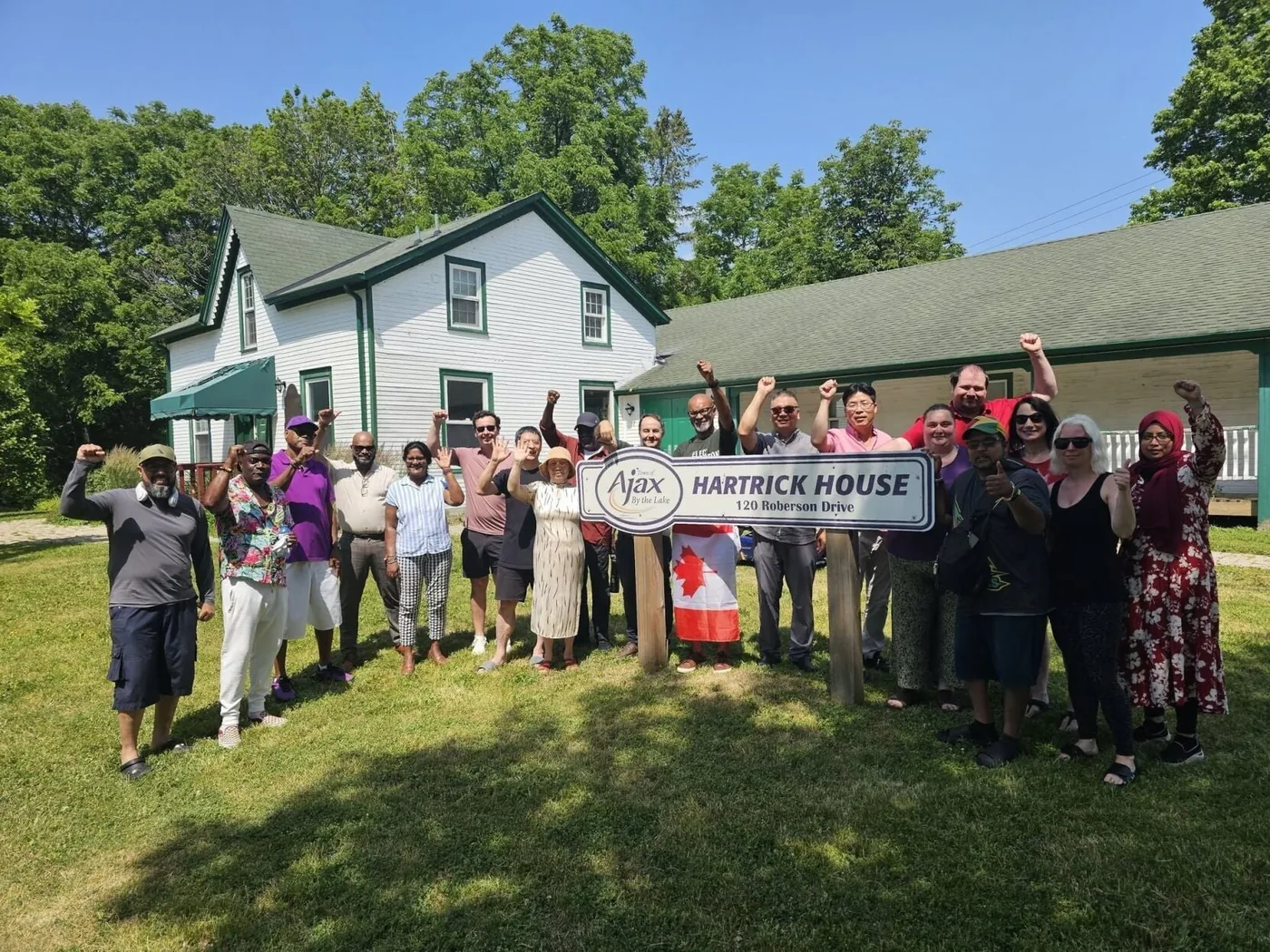 Supporters of the Hartrick House campaign outside the house at 120 Roberson Drive.